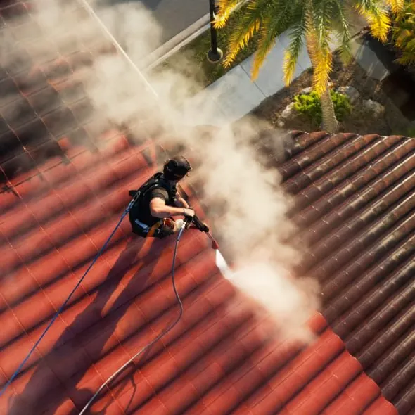 Kell Shot's Owner Ty on a Church Roof, cleaning black algae